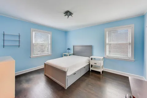 a bed room with a bed and a window