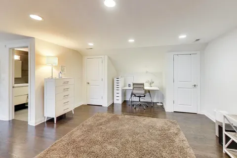 a view of kitchen with furniture and wooden floor