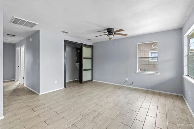 a view of an empty room with a window