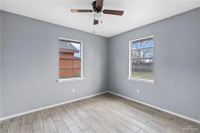 a view of an empty room with a window