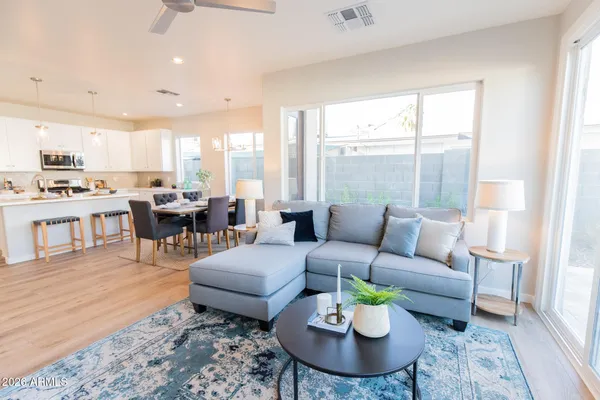 a living room with furniture and a large window