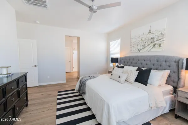 a bedroom with bed and a window