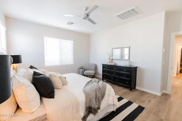 a bed room with a bed and a television
