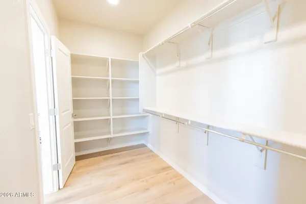 a view of an empty walk in closet