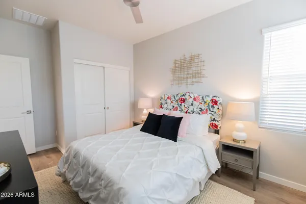 a bedroom with a bed and a desk