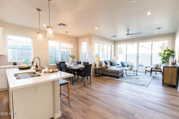 a living room with furniture and wooden floor
