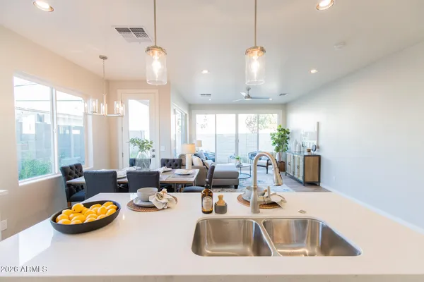a kitchen with a stove a sink and a refrigerator