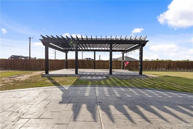 a view of a swimming pool with a yard