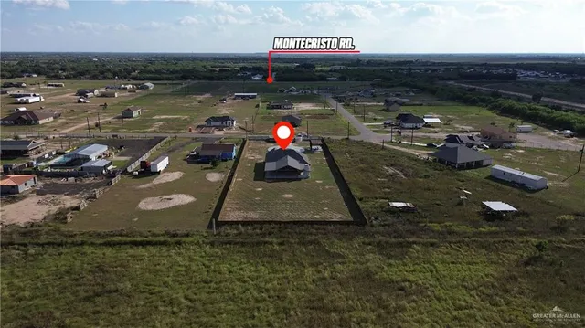 an aerial view of a city with lawn chairs