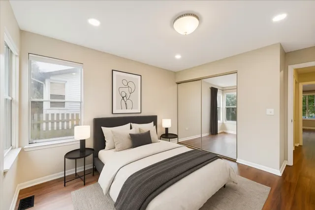 a bedroom with a large bed and a window