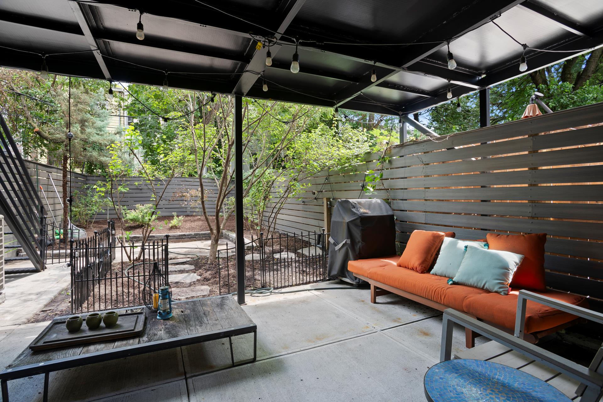 274 Eldert Street Brooklyn, NY 11207 - Photo 15 of 18 a outdoor sitting area with furniture and wooden deck