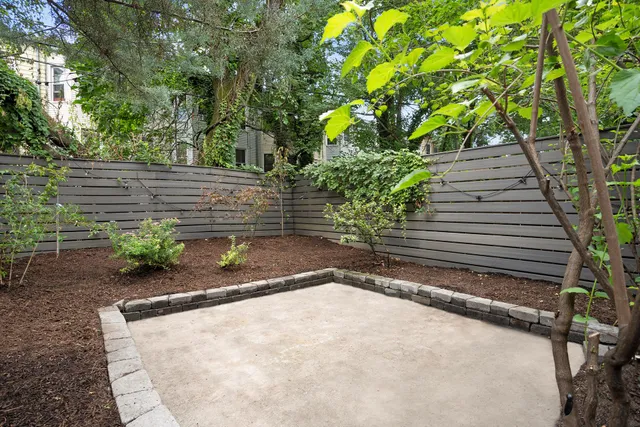 a outdoor sitting area with furniture and wooden deck