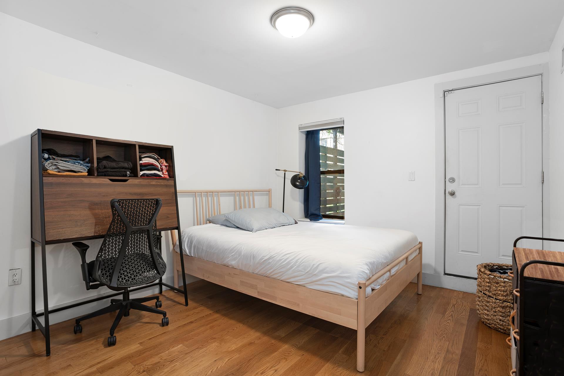 274 Eldert Street Brooklyn, NY 11207 - Photo 6 of 18 a bedroom with a bed and a desk