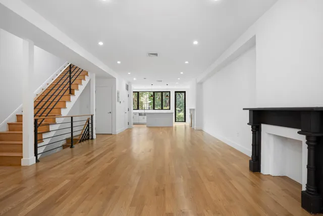 a view of balcony with wooden floor and fence