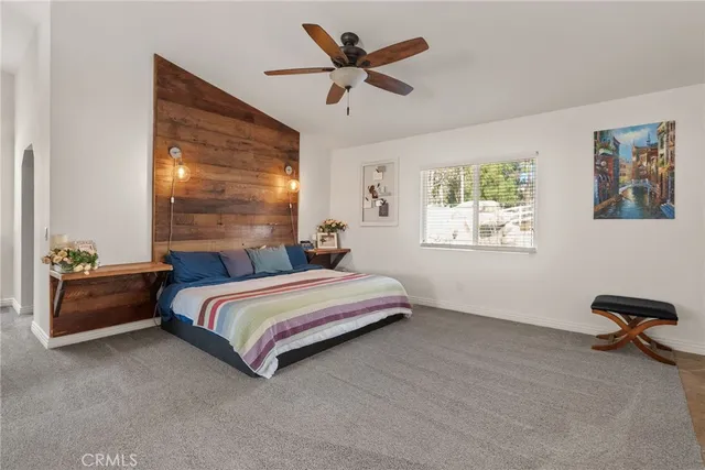 a view of a house with a yard balcony and sitting area