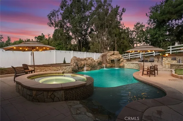 a kitchen with stainless steel appliances granite countertop a stove oven and a refrigerator