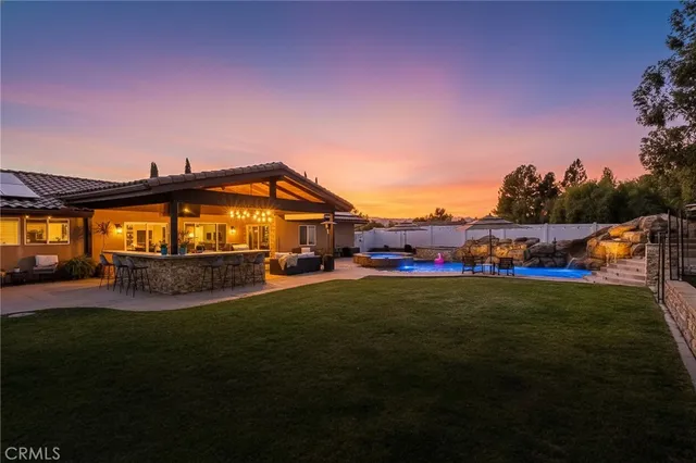a kitchen with granite countertop a sink and a window