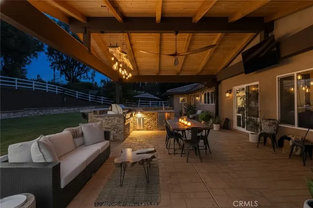 a kitchen with stainless steel appliances granite countertop a refrigerator and a stove