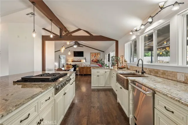 a living room with furniture fireplace and flat screen tv