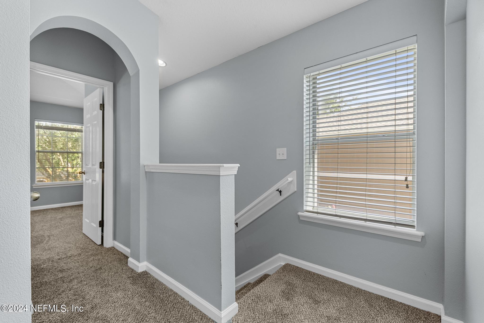 12939 Spring Rain Road Jacksonville, FL 32258 - Photo 12 of 30 a view of hallway with windows