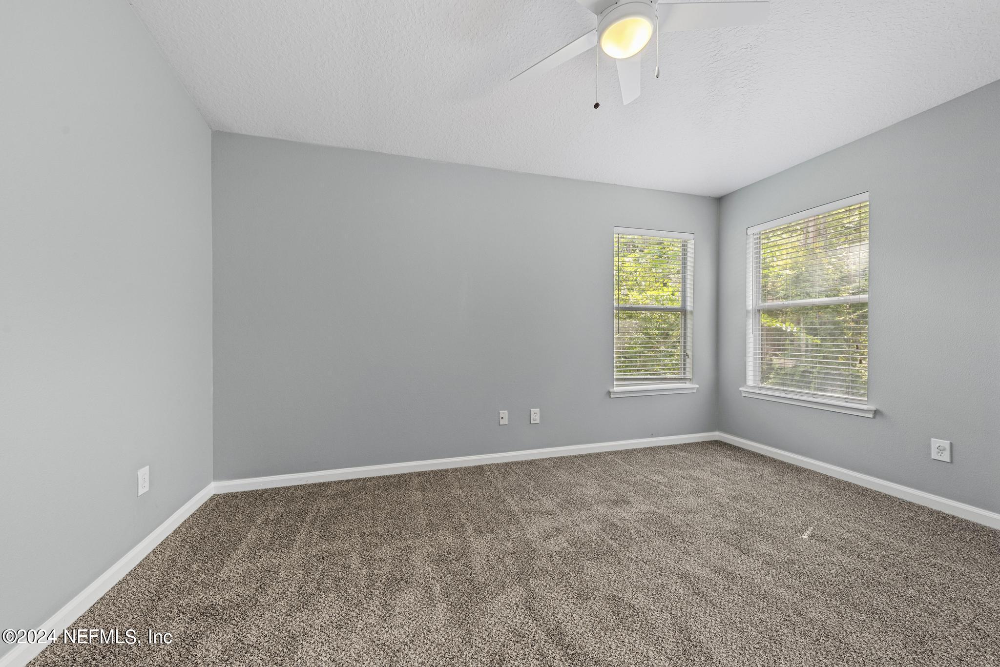 12939 Spring Rain Road Jacksonville, FL 32258 - Photo 16 of 30 a view of an empty room with a window