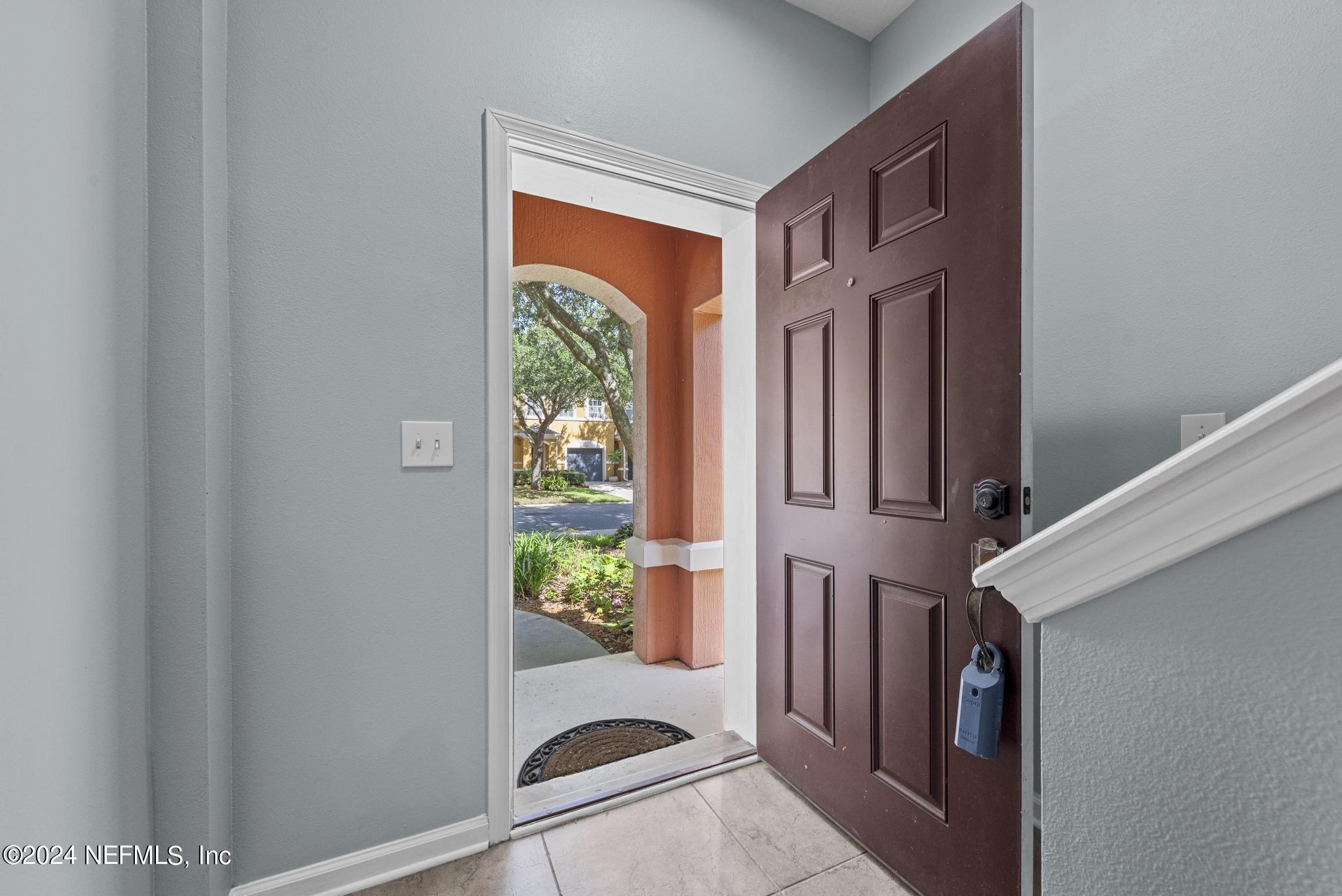 12939 Spring Rain Road Jacksonville, FL 32258 - Photo 3 of 30 a view of an entryway with wooden floor