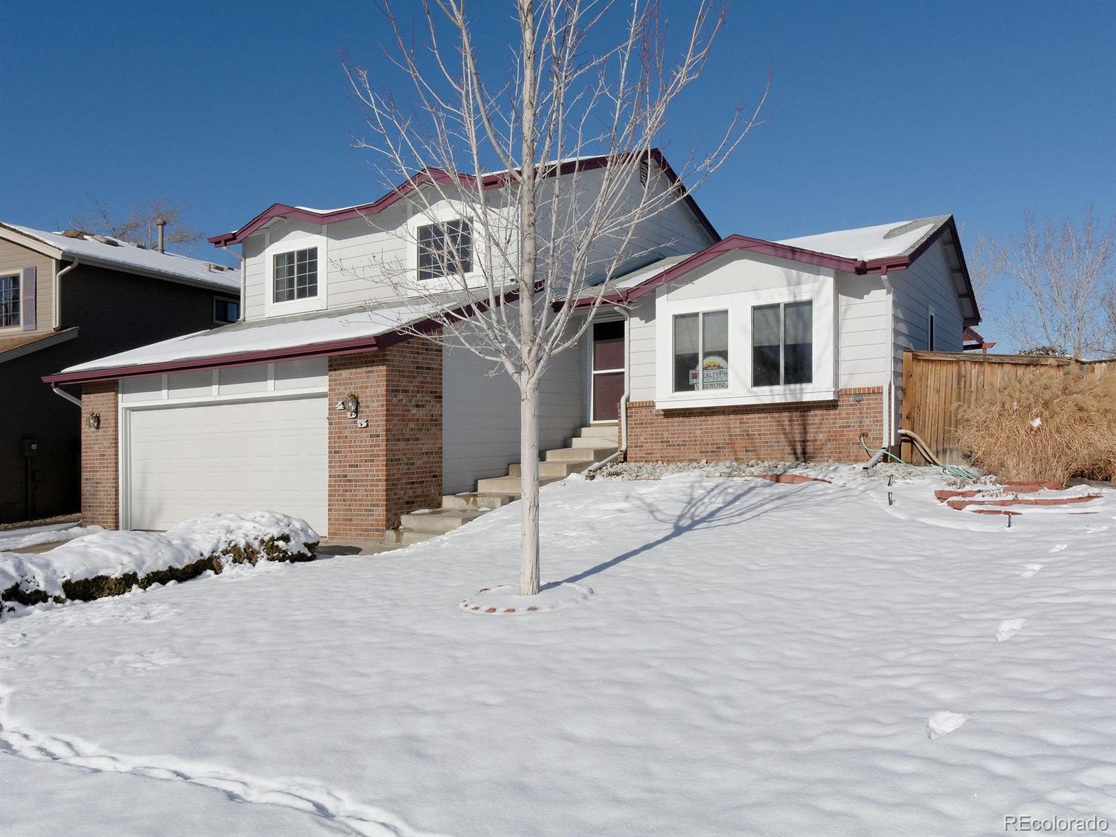 455 Saddlewood Circle Highlands Ranch, CO 80126 - Photo 1 of 1 a front view of a house with a yard