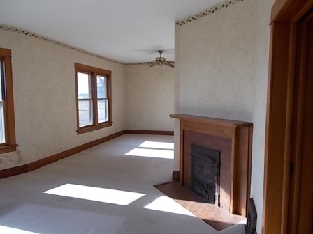 775 North Gorham Road Morris, IL 60450 - Photo 13 of 41 a view of an empty room with a fireplace and a window