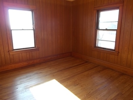 775 North Gorham Road Morris, IL 60450 - Photo 4 of 41 an empty room with wooden floor and windows