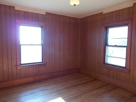 775 North Gorham Road Morris, IL 60450 - Photo 5 of 41 an empty room with wooden floor and windows