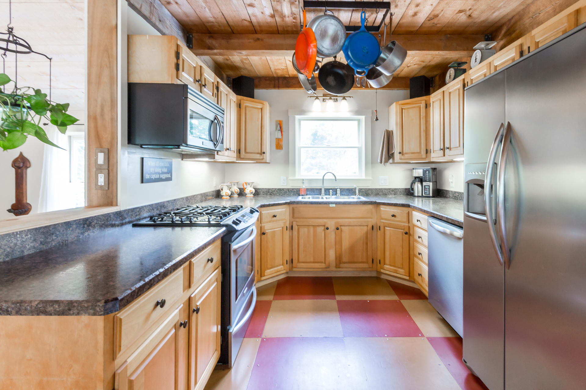 5 Marchants Path Edgartown, MA 02539 - Photo 14 of 45 a kitchen with stainless steel appliances granite countertop a sink a stove and a refrigerator