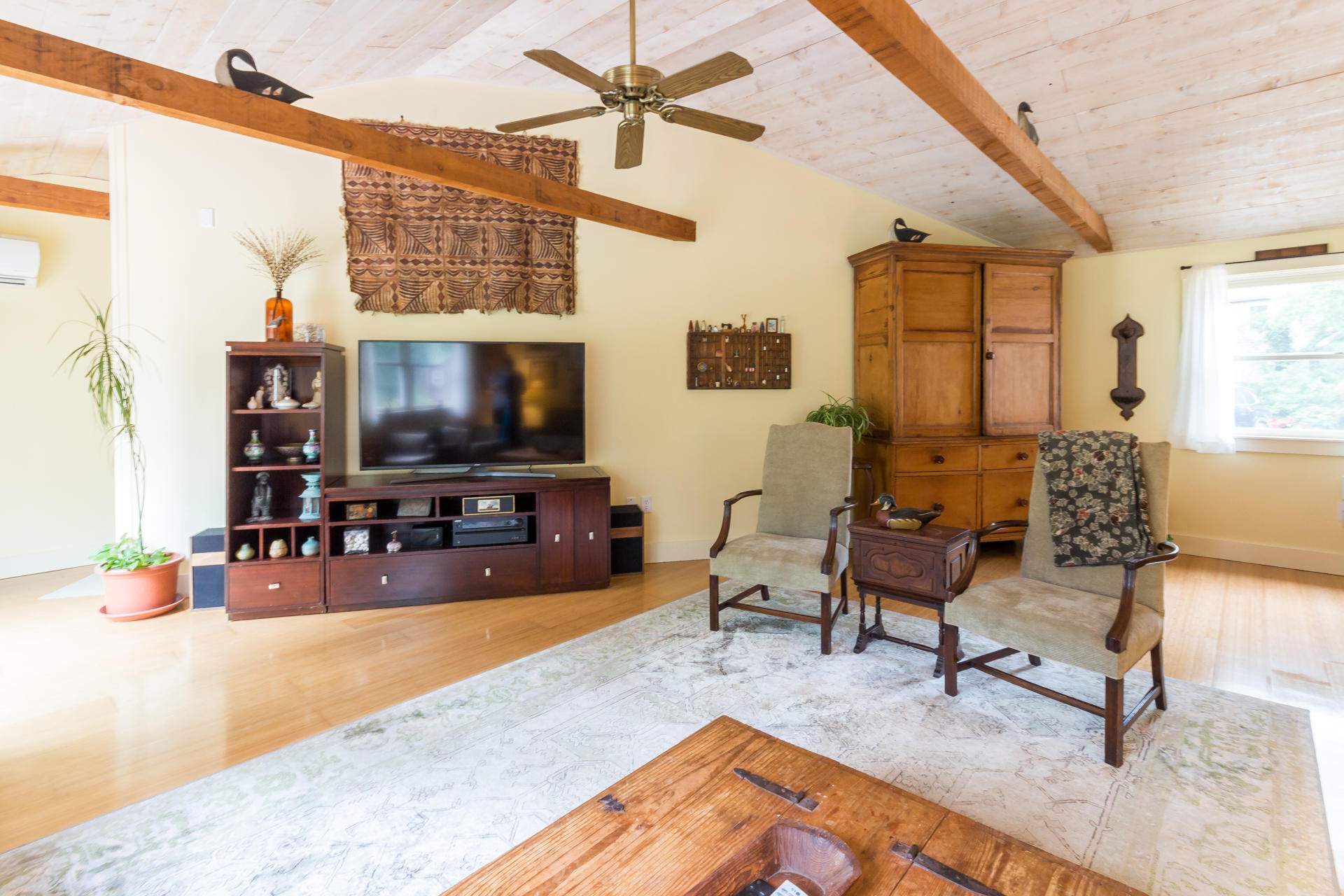 5 Marchants Path Edgartown, MA 02539 - Photo 16 of 45 a living room with furniture and a flat screen tv