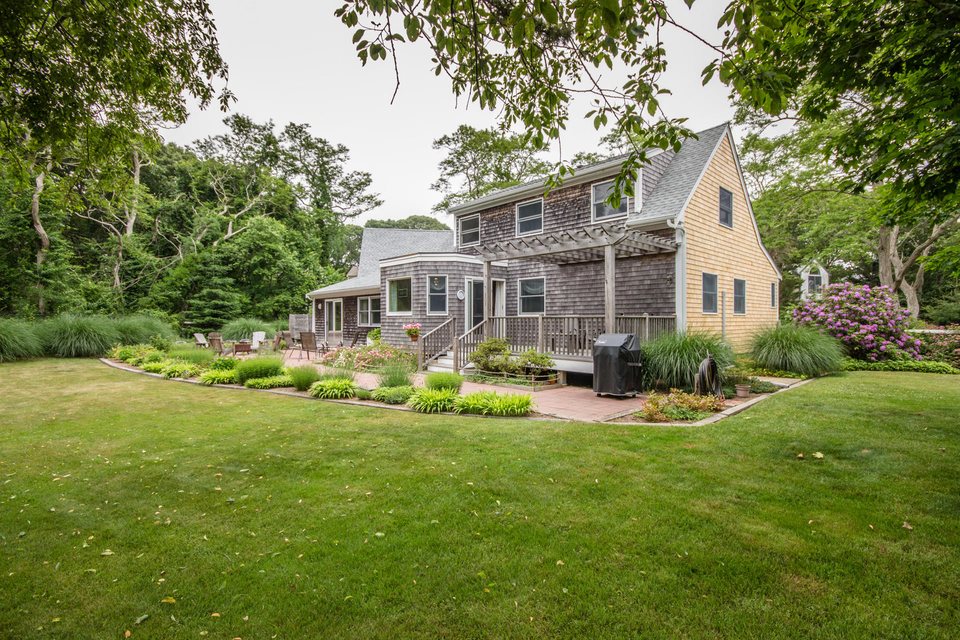 5 Marchants Path Edgartown, MA 02539 - Photo 2 of 45 a front view of house with yard and green space