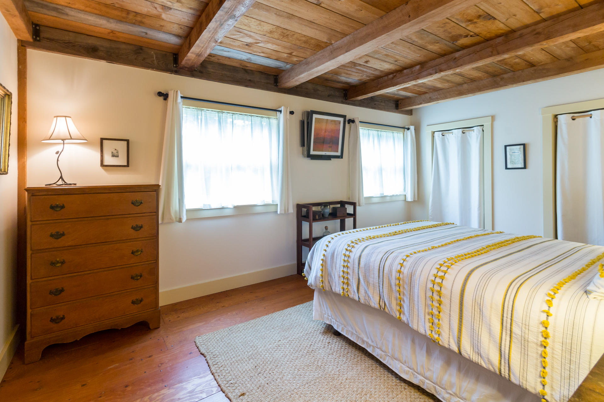 5 Marchants Path Edgartown, MA 02539 - Photo 5 of 45 a bedroom with a bed and a dresser