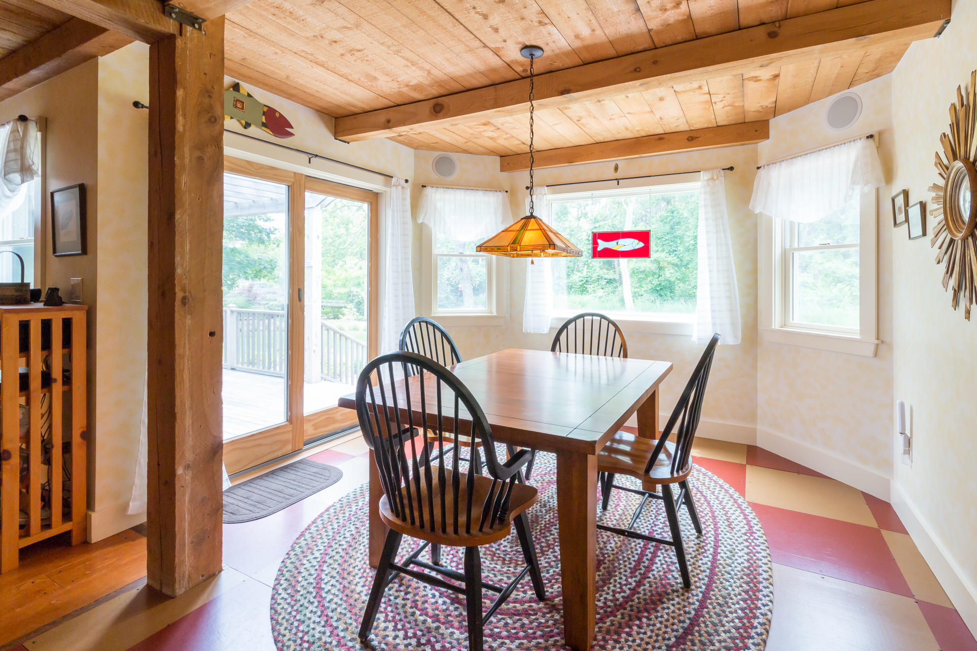 5 Marchants Path Edgartown, MA 02539 - Photo 10 of 45 a dining room with furniture wooden floor and a potted plant