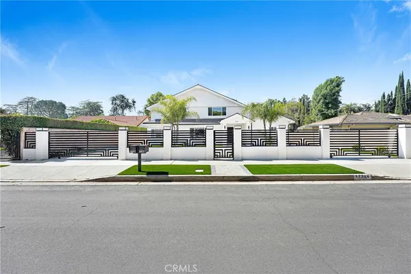 a house with trees in the background