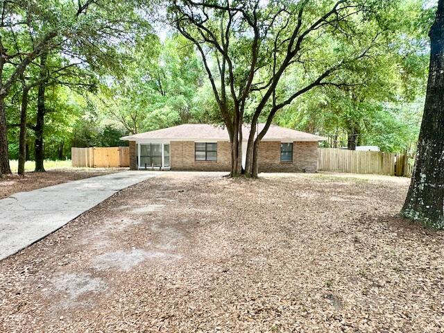 423 John King Road Crestview, FL 32539 - Photo 1 of 28 a house with trees in front of it