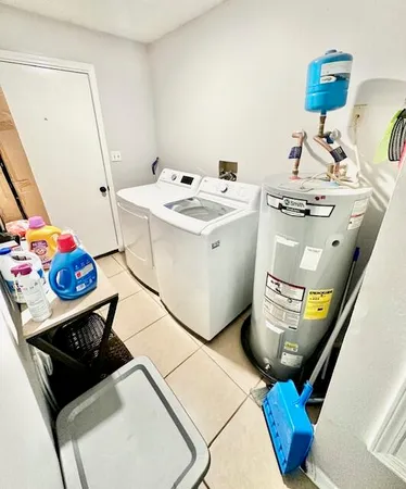 a utility room with dryer and washer
