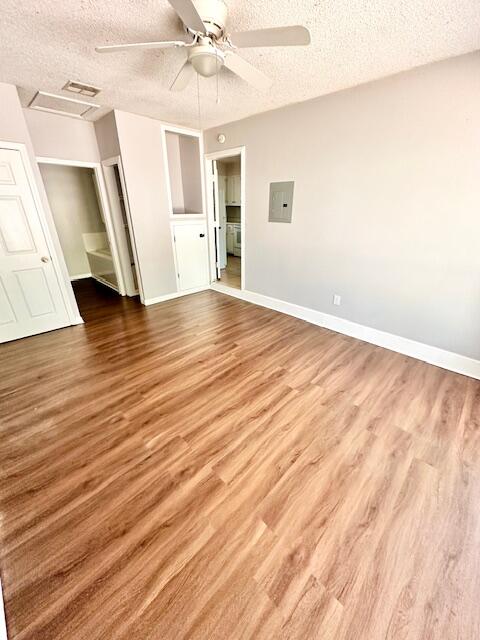 423 John King Road Crestview, FL 32539 - Photo 14 of 28 an empty room with wooden floor and ceiling fan