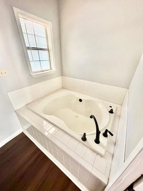 423 John King Road Crestview, FL 32539 - Photo 18 of 28 a bathroom with a bathtub and window