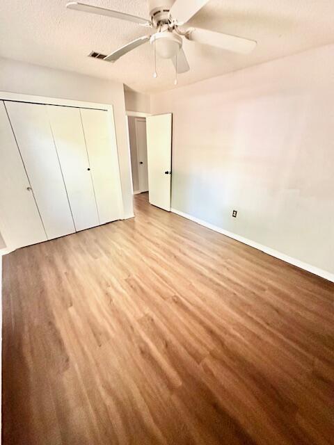 423 John King Road Crestview, FL 32539 - Photo 20 of 28 an empty room with wooden floor and windows