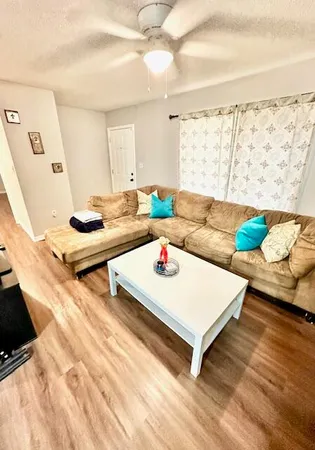 a living room with furniture and a table