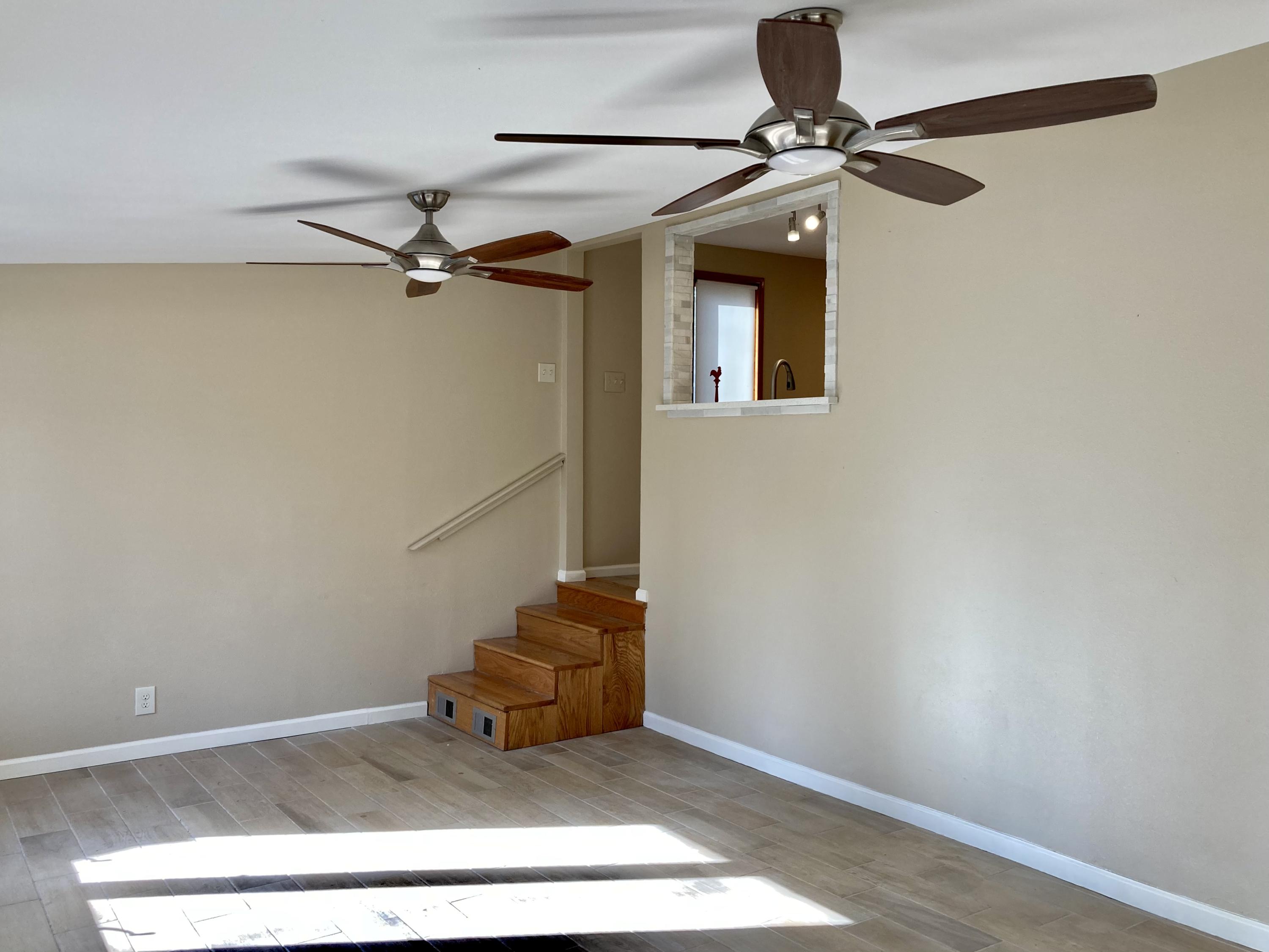 10 East Wild Briar Road Santa Rosa Beach, FL 32459 - Photo 29 of 54 a picture of a room with stairs and a ceiling fan