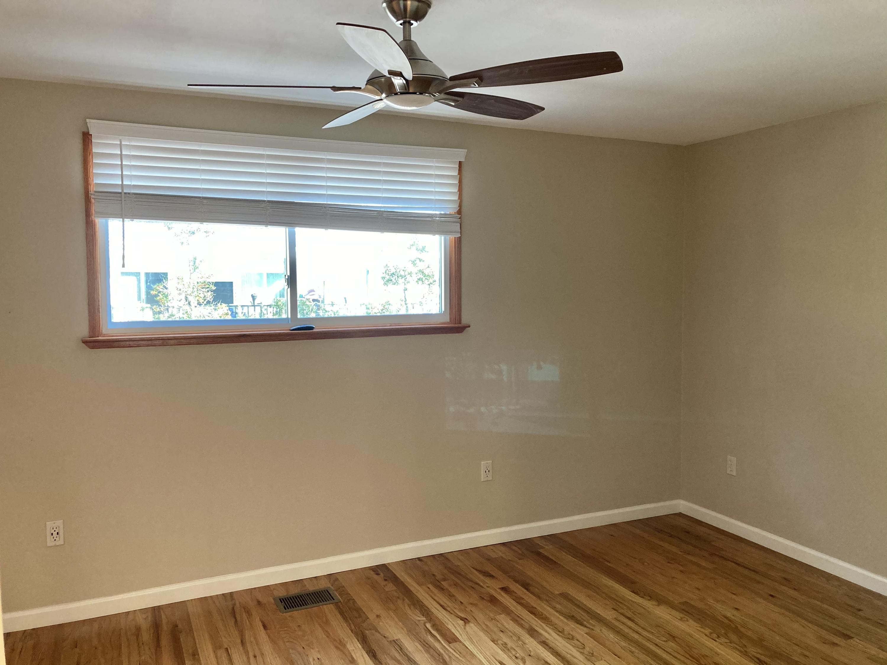 10 East Wild Briar Road Santa Rosa Beach, FL 32459 - Photo 32 of 54 a view of an empty room with wooden floor and a window