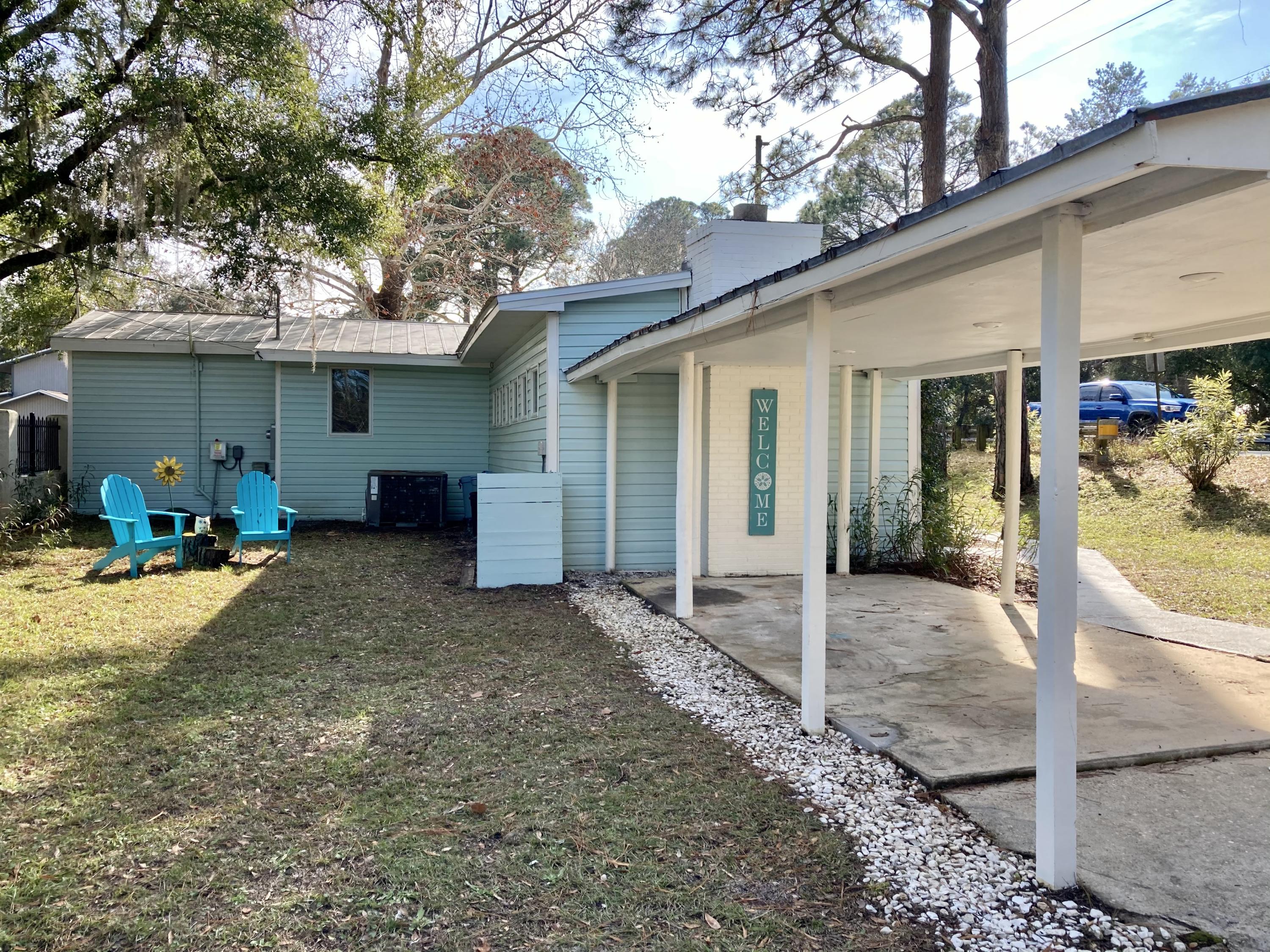 10 East Wild Briar Road Santa Rosa Beach, FL 32459 - Photo 10 of 54 a view of a house with backyard and furniture