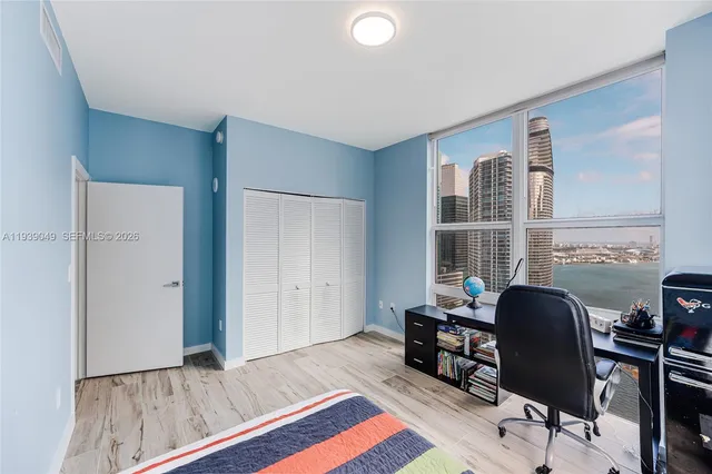 a living room with furniture flat screen tv and a fireplace