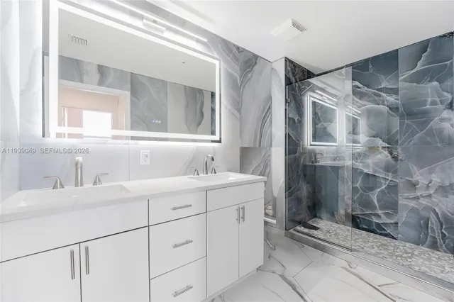 a bathroom with a sink and vanity