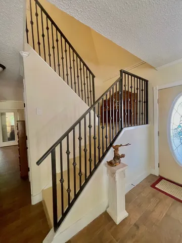 a view of entryway with wooden floor