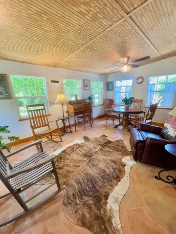 a outdoor space with lots of furniture and a rug