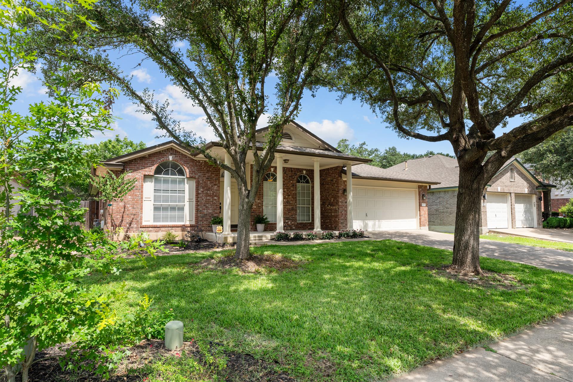4725 Tello Path Austin, TX 78749 - Photo 33 of 34 A well-maintained lawn and mature shade trees frame this charming brick home.